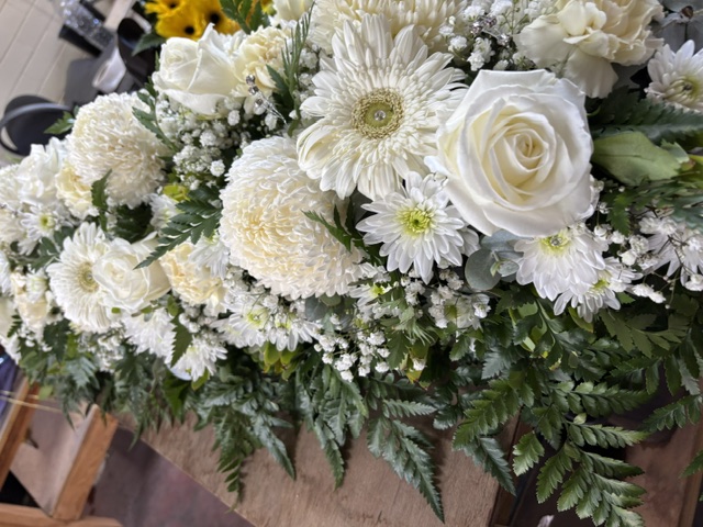 White casket spray detail